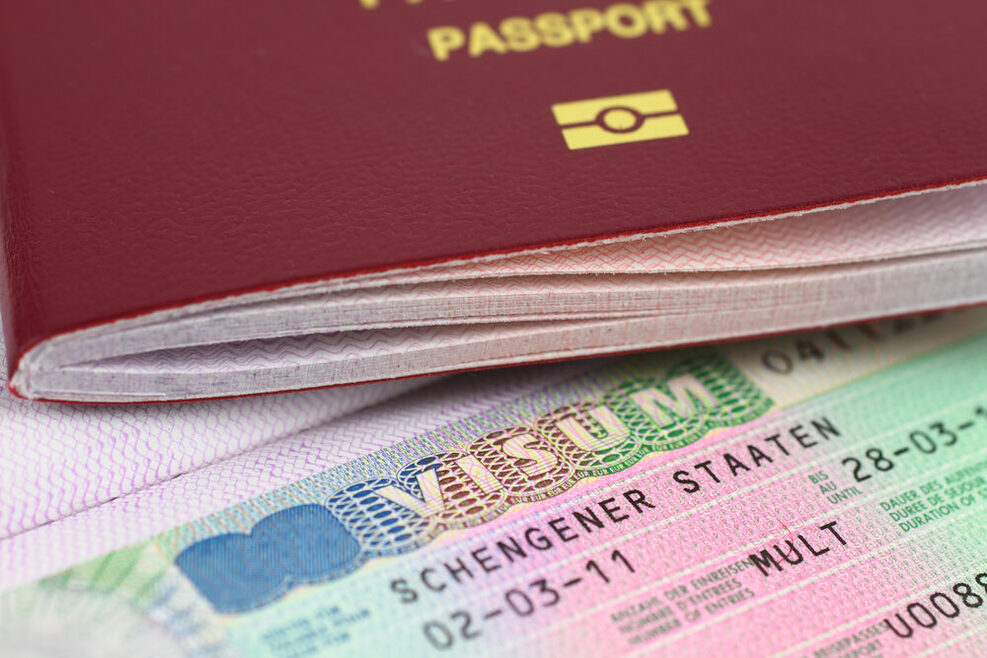 A Closeup of an Passport and a Visa.
